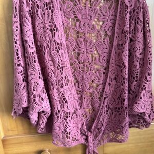 Crocheted shawl/sweater never worn. Beautiful rose color with no flaws.
